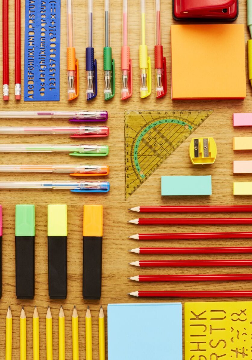 office-and-school-supplies-arranged-on-wooden-table-royalty-free-image-1687558904